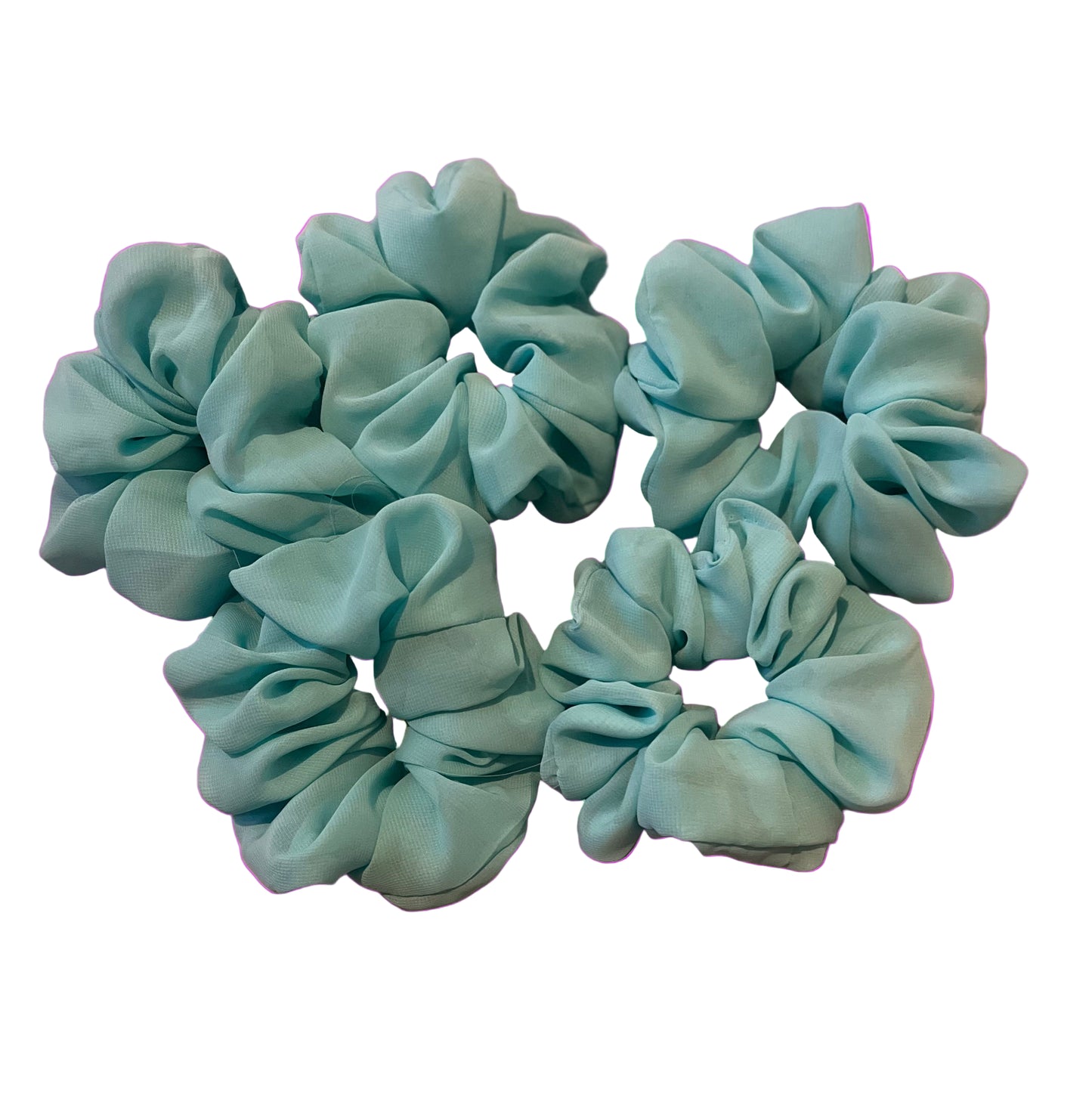 Mint green chiffon scrunchies with pink background